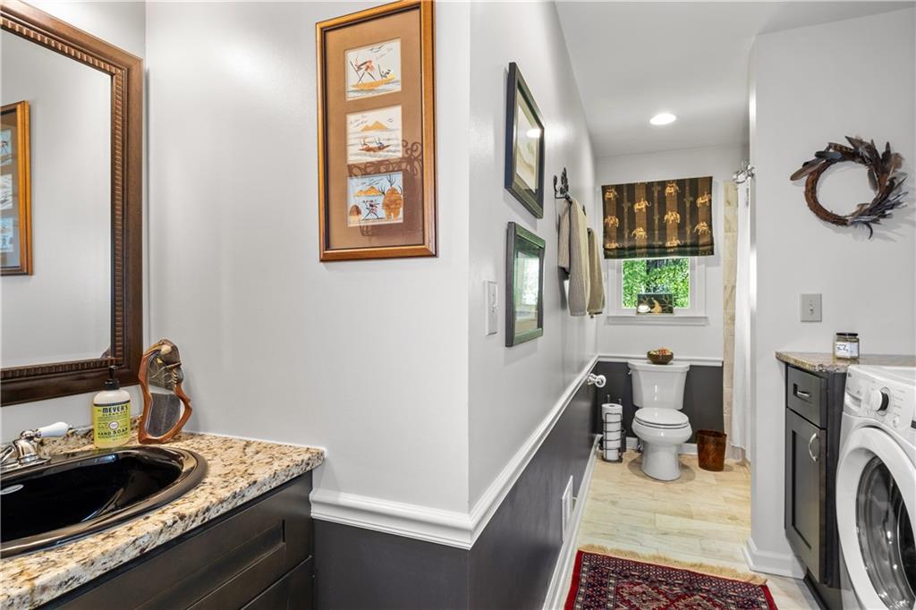 511 Oakdale Road Canton, GA 30114 - Photo 14 of 50 a room with furniture and a mirror