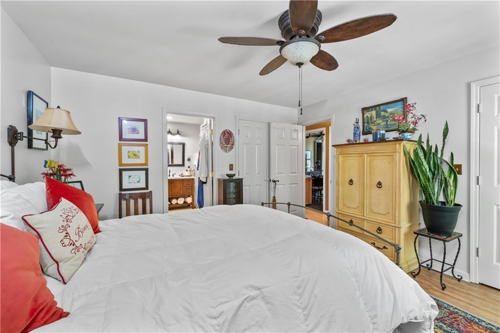 511 Oakdale Road Canton, GA 30114 - Photo 19 of 50 a bedroom with a bed chandelier and a window