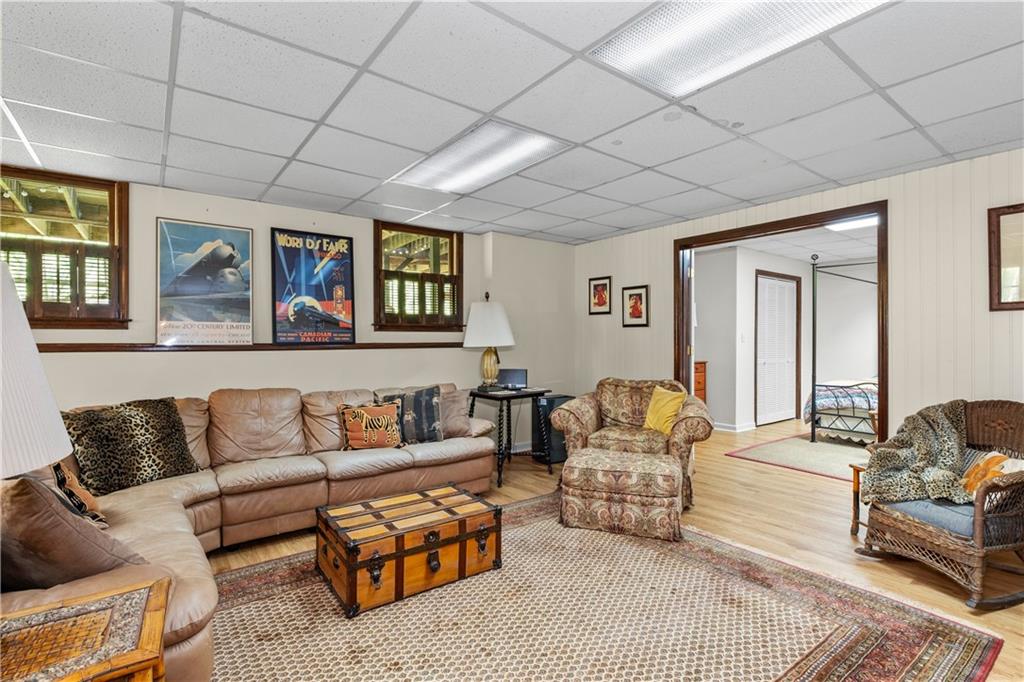 511 Oakdale Road Canton, GA 30114 - Photo 25 of 50 a living room with furniture and painting on the wall