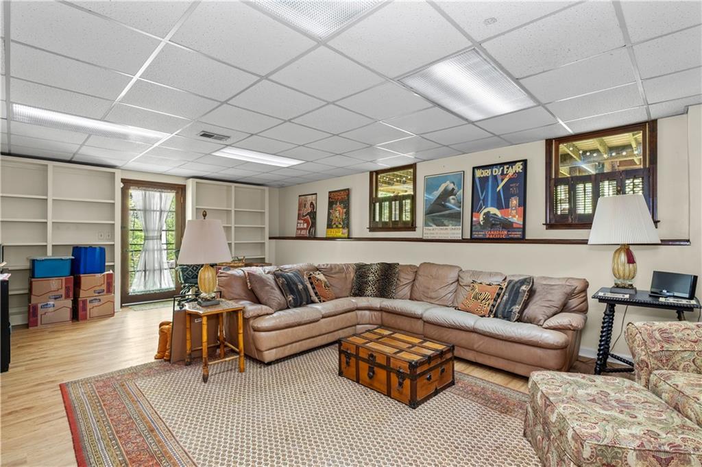 511 Oakdale Road Canton, GA 30114 - Photo 26 of 50 a living room with furniture and a wooden floor