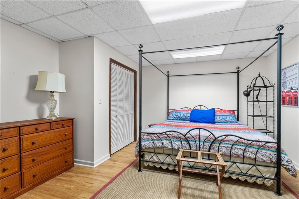 511 Oakdale Road Canton, GA 30114 - Photo 27 of 50 a bedroom with furniture and a lamp