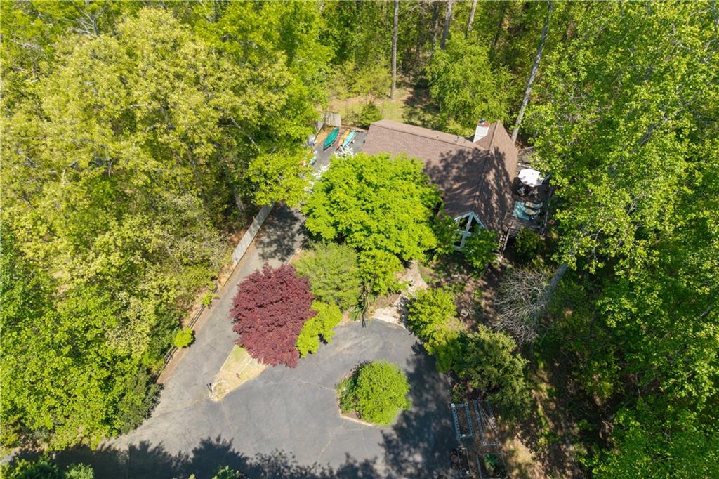 511 Oakdale Road Canton, GA 30114 - Photo 29 of 50 an aerial view of residential house with outdoor space and trees all around