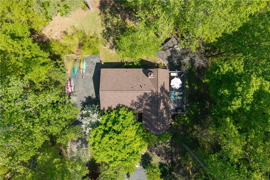 511 Oakdale Road Canton, GA 30114 - Photo 30 of 50 an aerial view of a house with a yard and large trees
