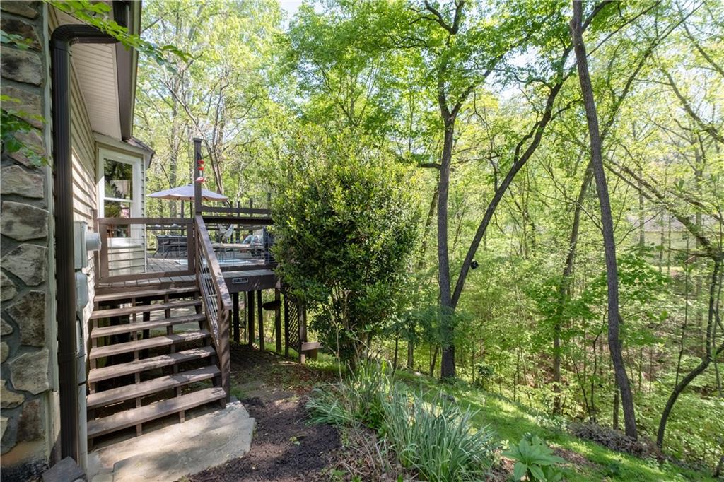 511 Oakdale Road Canton, GA 30114 - Photo 32 of 50 a view of a chairs and table in the backyard