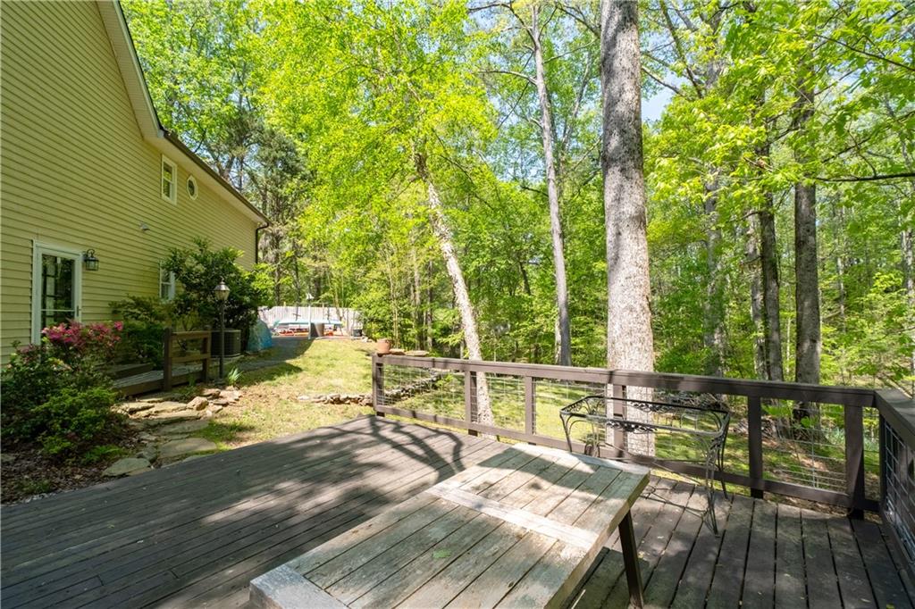 511 Oakdale Road Canton, GA 30114 - Photo 38 of 50 a view of deck with patio and garden