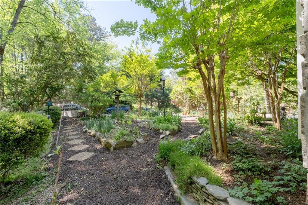 511 Oakdale Road Canton, GA 30114 - Photo 39 of 50 a backyard of a house with lots of green space