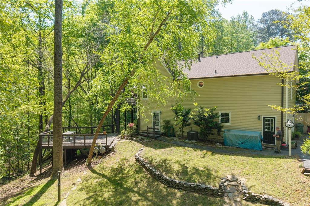 511 Oakdale Road Canton, GA 30114 - Photo 44 of 50 a backyard of a house with lots of green space