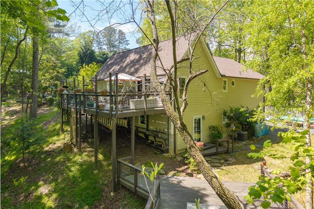 511 Oakdale Road Canton, GA 30114 - Photo 46 of 50 a backyard of a house with table and chairs