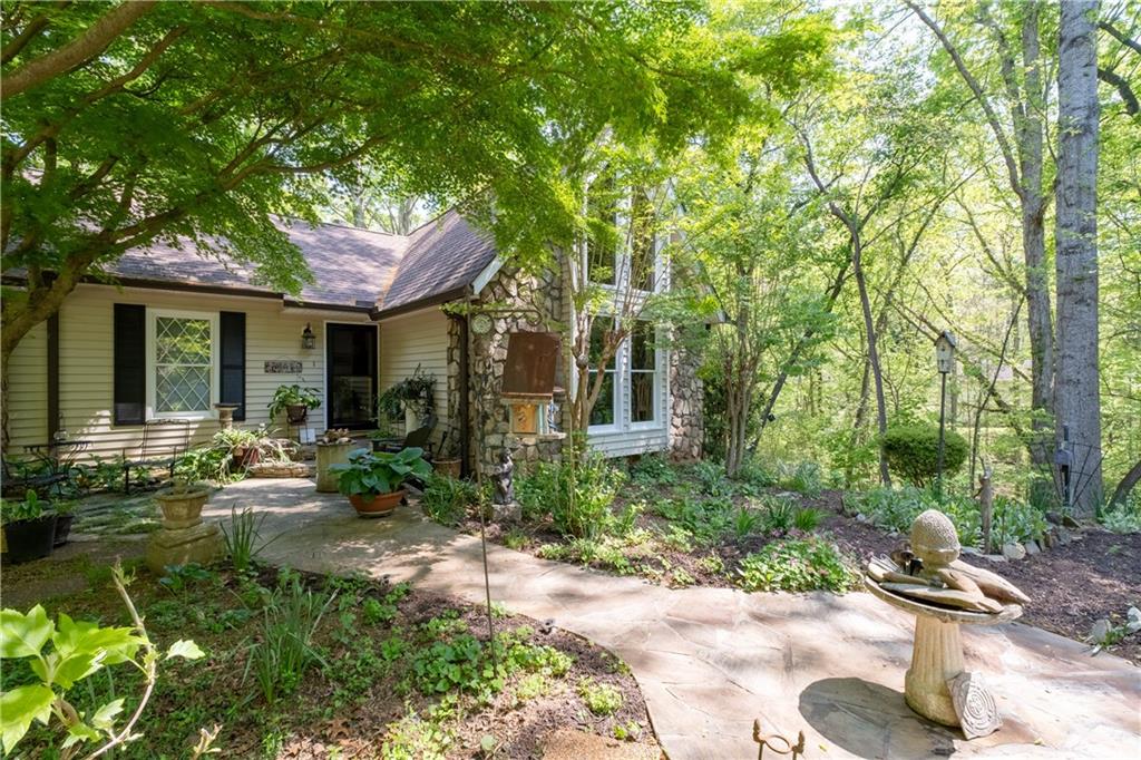 511 Oakdale Road Canton, GA 30114 - Photo 47 of 50 a backyard of a house with yard and outdoor seating