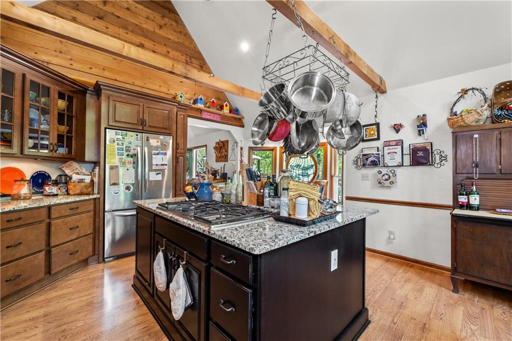 511 Oakdale Road Canton, GA 30114 - Photo 5 of 50 a kitchen with stainless steel appliances granite countertop a sink dishwasher stove and wooden floor