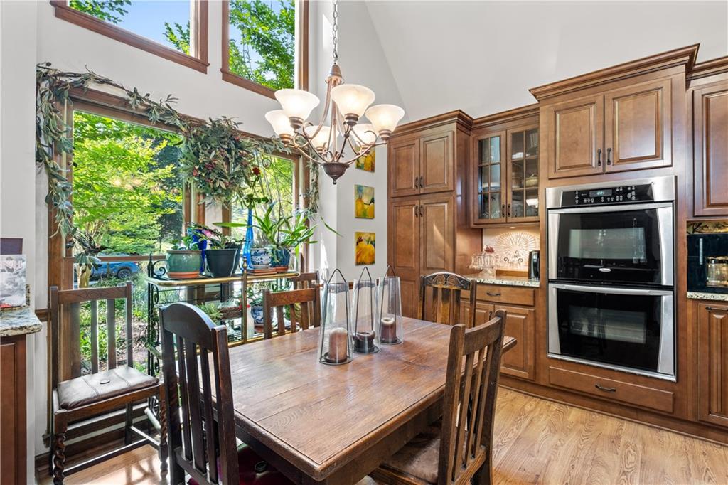 511 Oakdale Road Canton, GA 30114 - Photo 7 of 50 a view of a dining room with furniture window and wooden floor