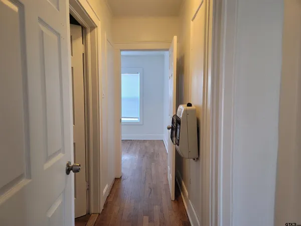 a bathroom with a glass door shower and a sink