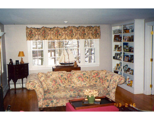 91 Concord Road Acton, MA 01720 - Photo 11 of 12 a living room with furniture window and wooden floor