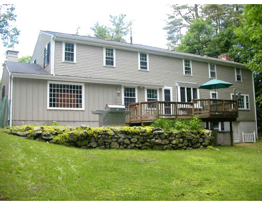 91 Concord Road Acton, MA 01720 - Photo 2 of 12 a front view of a house with a garden