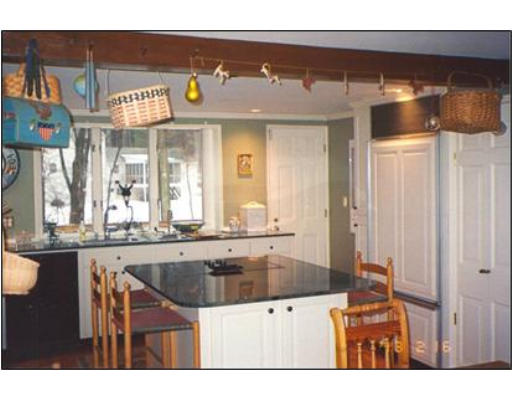 91 Concord Road Acton, MA 01720 - Photo 3 of 12 a kitchen with stainless steel appliances granite countertop a sink and cabinets