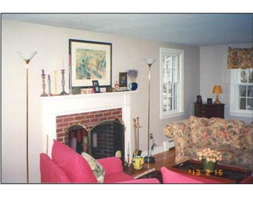 91 Concord Road Acton, MA 01720 - Photo 4 of 12 a bedroom with a bed and a fireplace