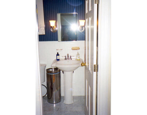 91 Concord Road Acton, MA 01720 - Photo 8 of 12 a bathroom with a sink and mirror