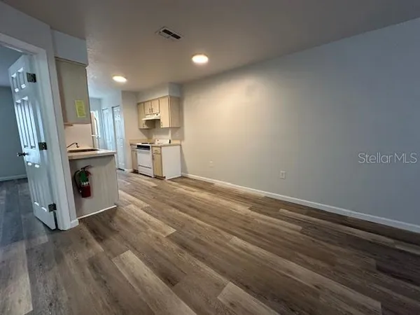 a view of kitchen and wooden floor