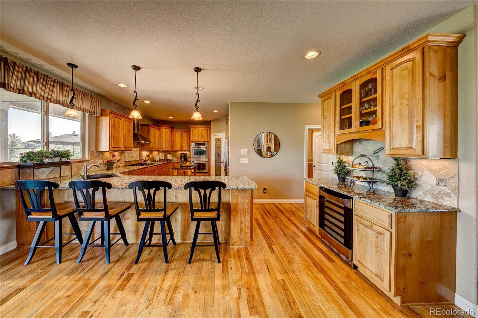 37053 Soaring Eagle Circle Severance, CO 80550 - Photo 13 of 35 a very nice looking kitchen with a large window