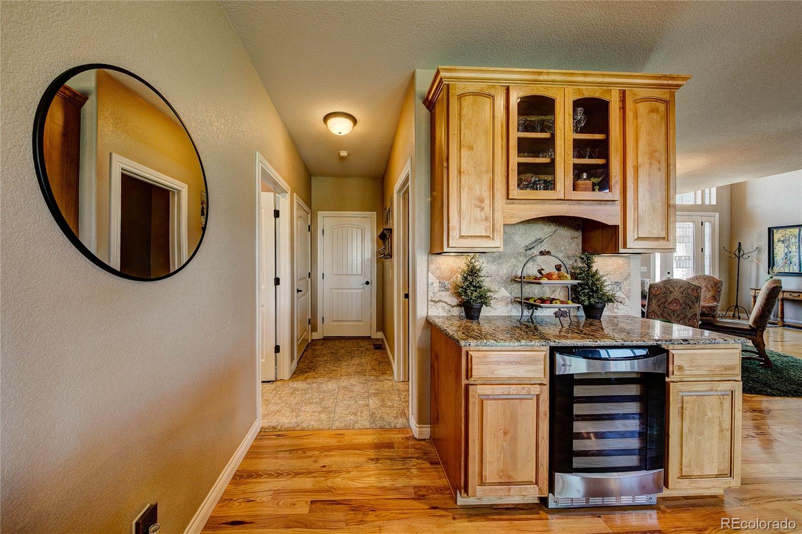 37053 Soaring Eagle Circle Severance, CO 80550 - Photo 15 of 35 a view of a hallway with entryway dining room and chandelier