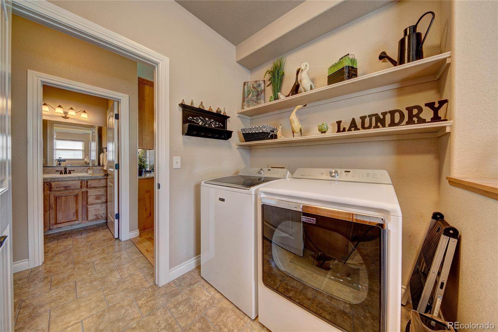 37053 Soaring Eagle Circle Severance, CO 80550 - Photo 17 of 35 a utility room with washer and dryer