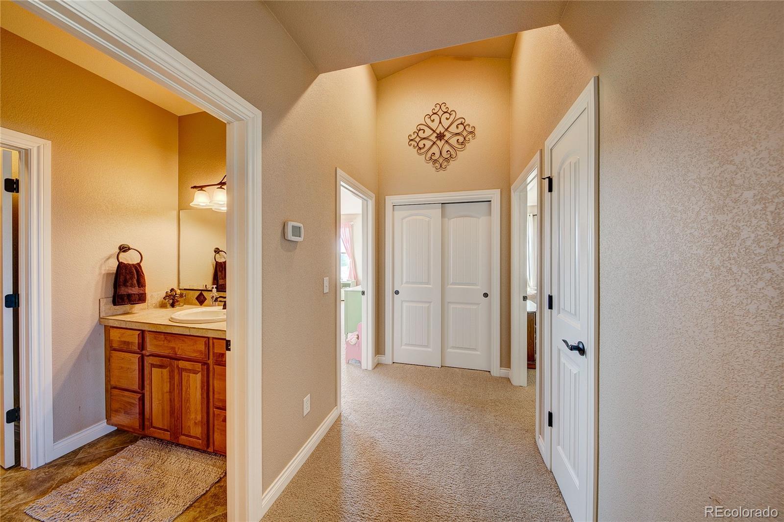 37053 Soaring Eagle Circle Severance, CO 80550 - Photo 24 of 35 a view of a kitchen from the hallway