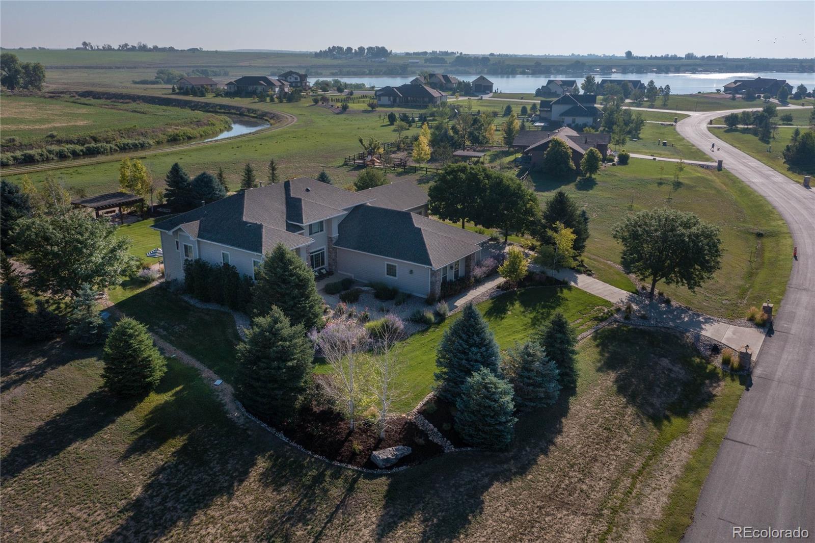 37053 Soaring Eagle Circle Severance, CO 80550 - Photo 3 of 35 an aerial view of residential houses with outdoor space and river