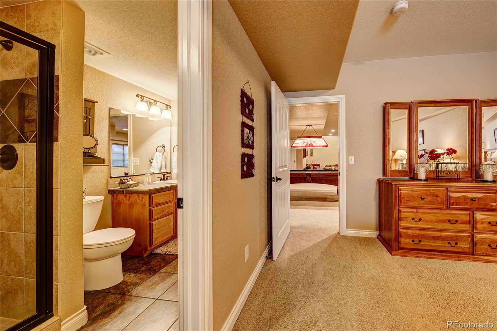 37053 Soaring Eagle Circle Severance, CO 80550 - Photo 33 of 35 a bathroom with a sink and a mirror