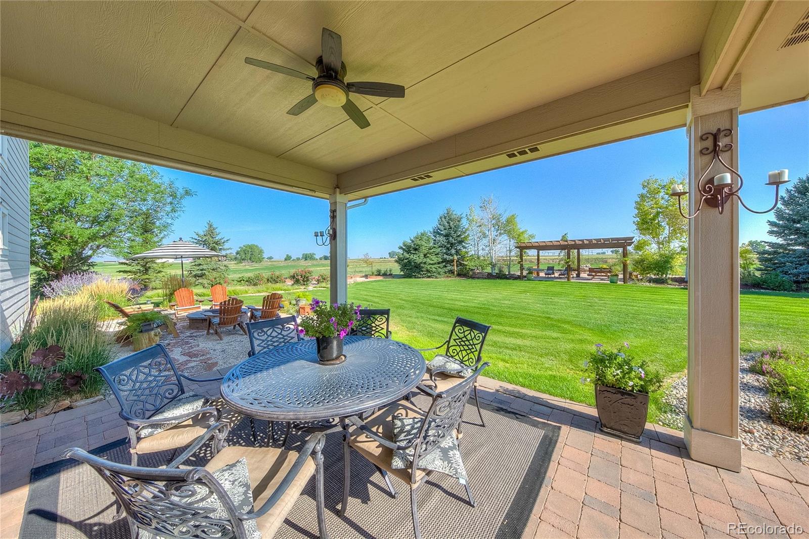 37053 Soaring Eagle Circle Severance, CO 80550 - Photo 6 of 35 a view of a patio with a table chairs and a table