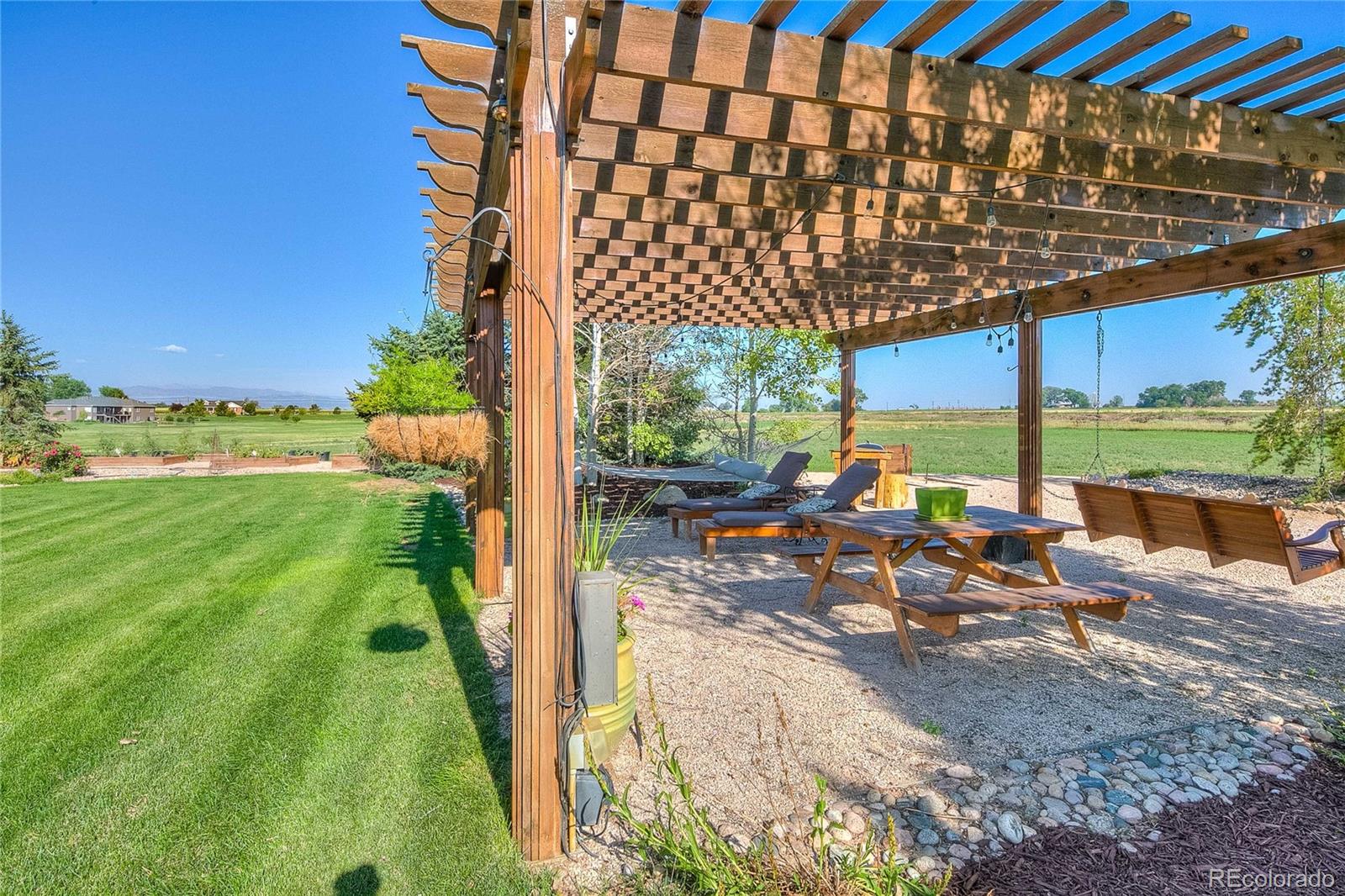 37053 Soaring Eagle Circle Severance, CO 80550 - Photo 9 of 35 a view of swimming pool with outdoor seating and plants