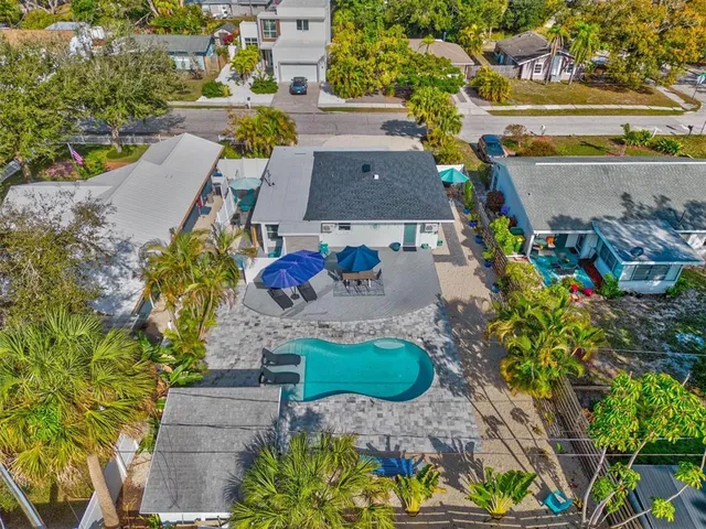 a view of a swimming pool with a yard