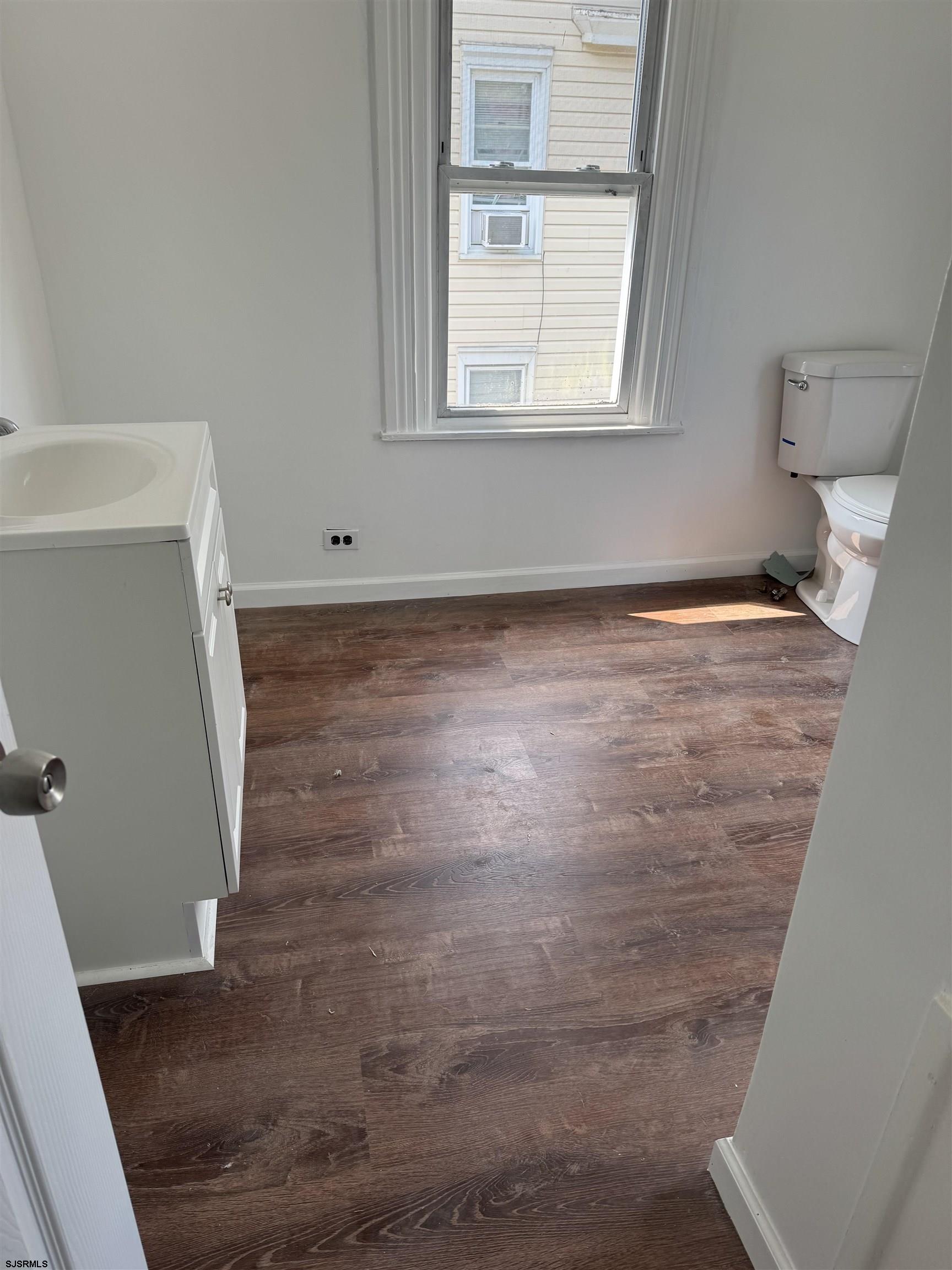 87 West Pitman Street Penns Grove, NJ 08069 - Photo 6 of 9 a view of a room with wooden floor and window