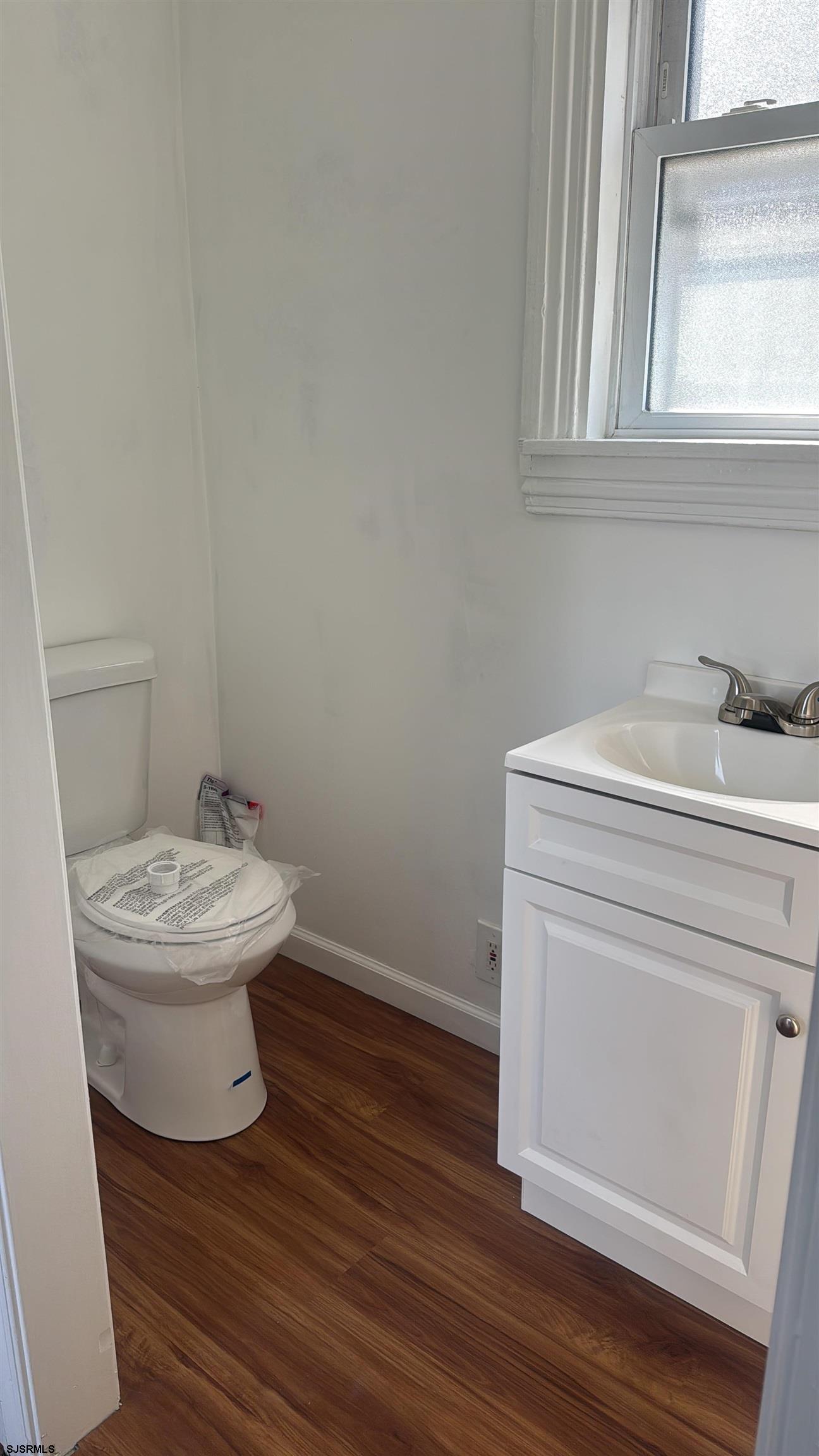 87 West Pitman Street Penns Grove, NJ 08069 - Photo 8 of 9 a bathroom with a toilet sink and mirror