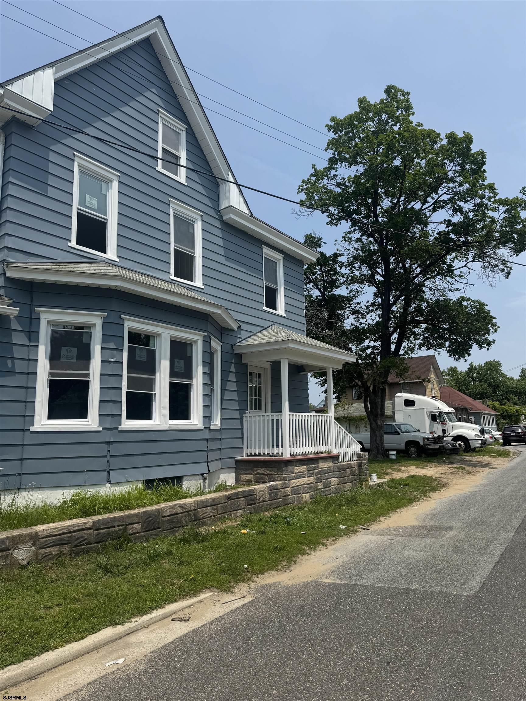 87 West Pitman Street Penns Grove, NJ 08069 - Photo 9 of 9 a front view of a house with a yard