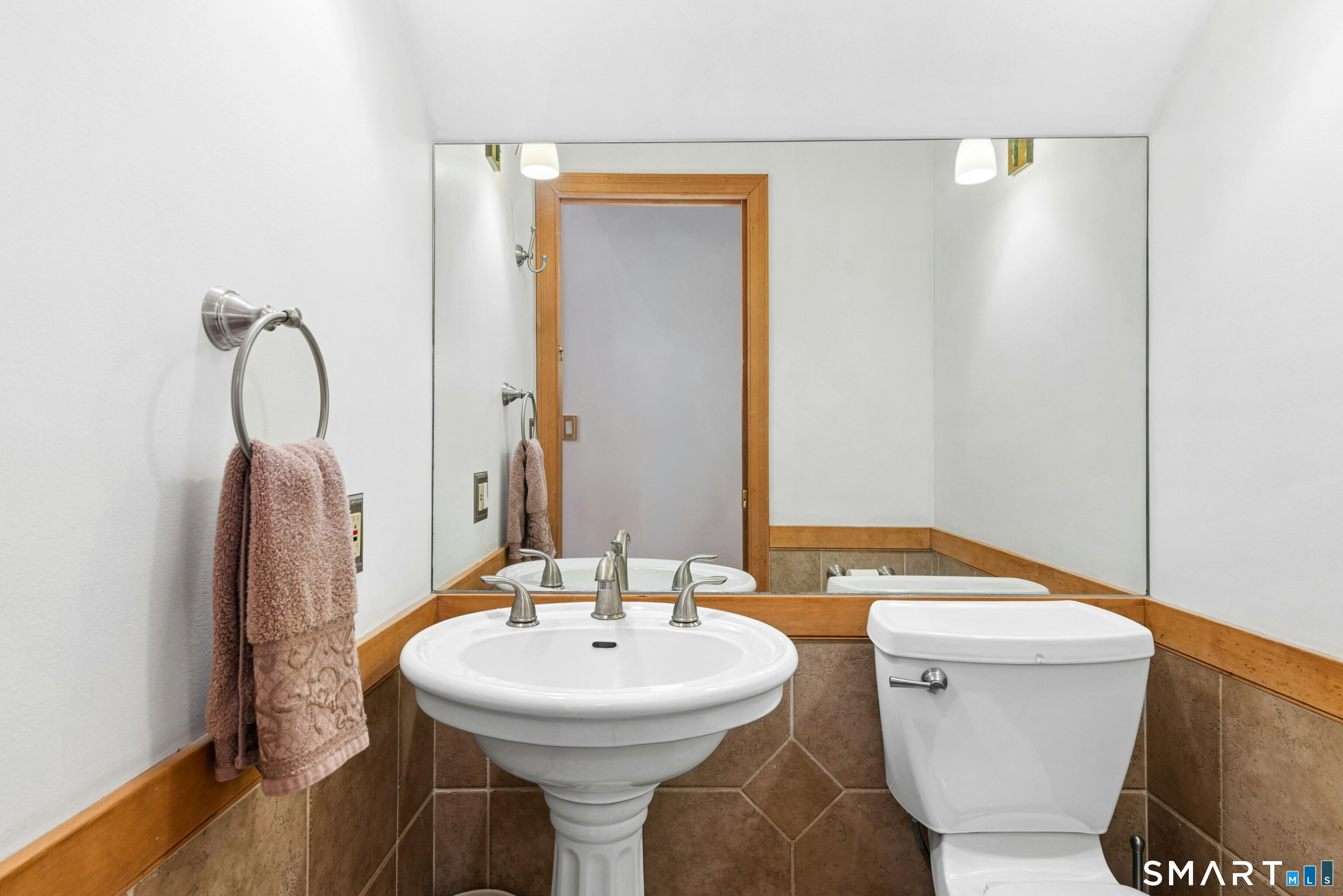 9 A Obtuse Rocks Road Brookfield, CT 06804 - Photo 15 of 36 a bathroom with a sink and a mirror