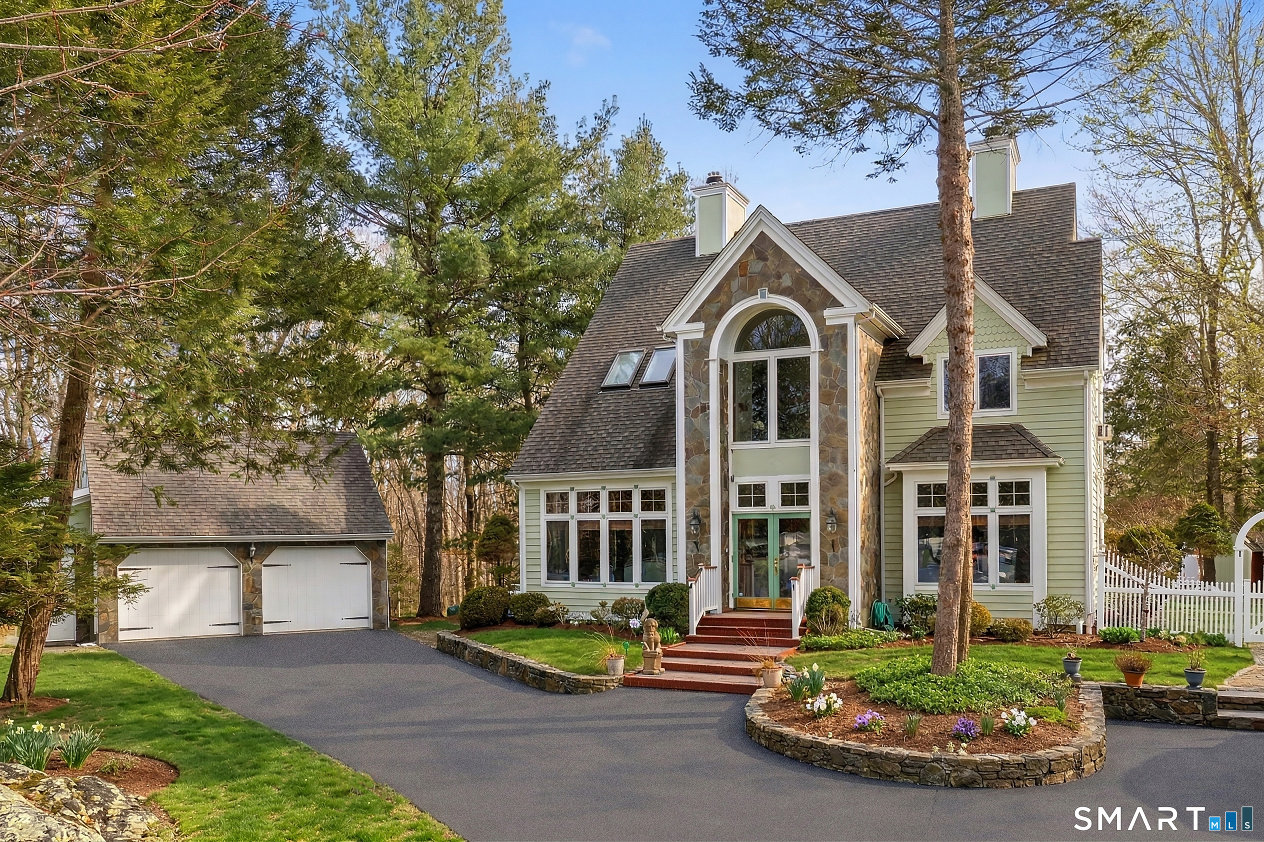 9 A Obtuse Rocks Road Brookfield, CT 06804 - Photo 2 of 36 front view of a house with a yard