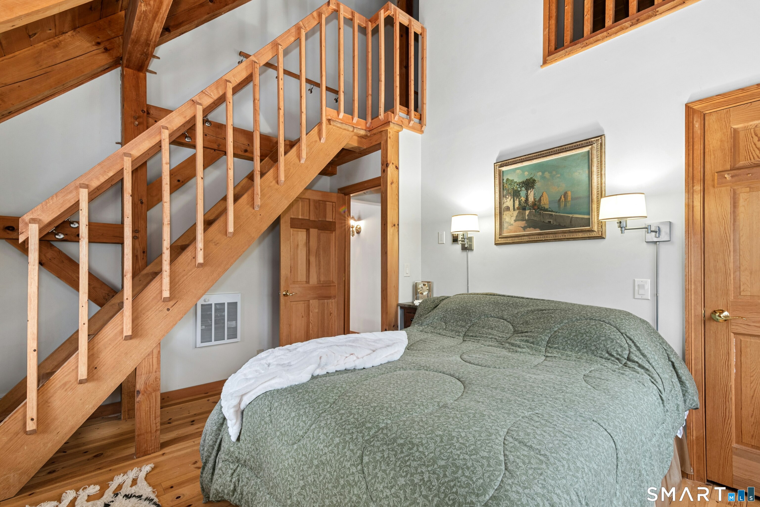 9 A Obtuse Rocks Road Brookfield, CT 06804 - Photo 23 of 36 a bedroom with a bed and a wooden floor