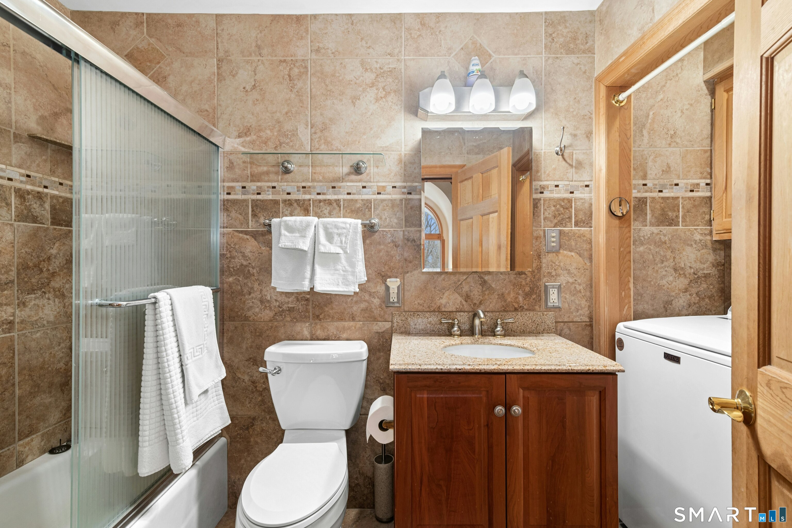 9 A Obtuse Rocks Road Brookfield, CT 06804 - Photo 24 of 36 a bathroom with a sink vanity mirror and toilet