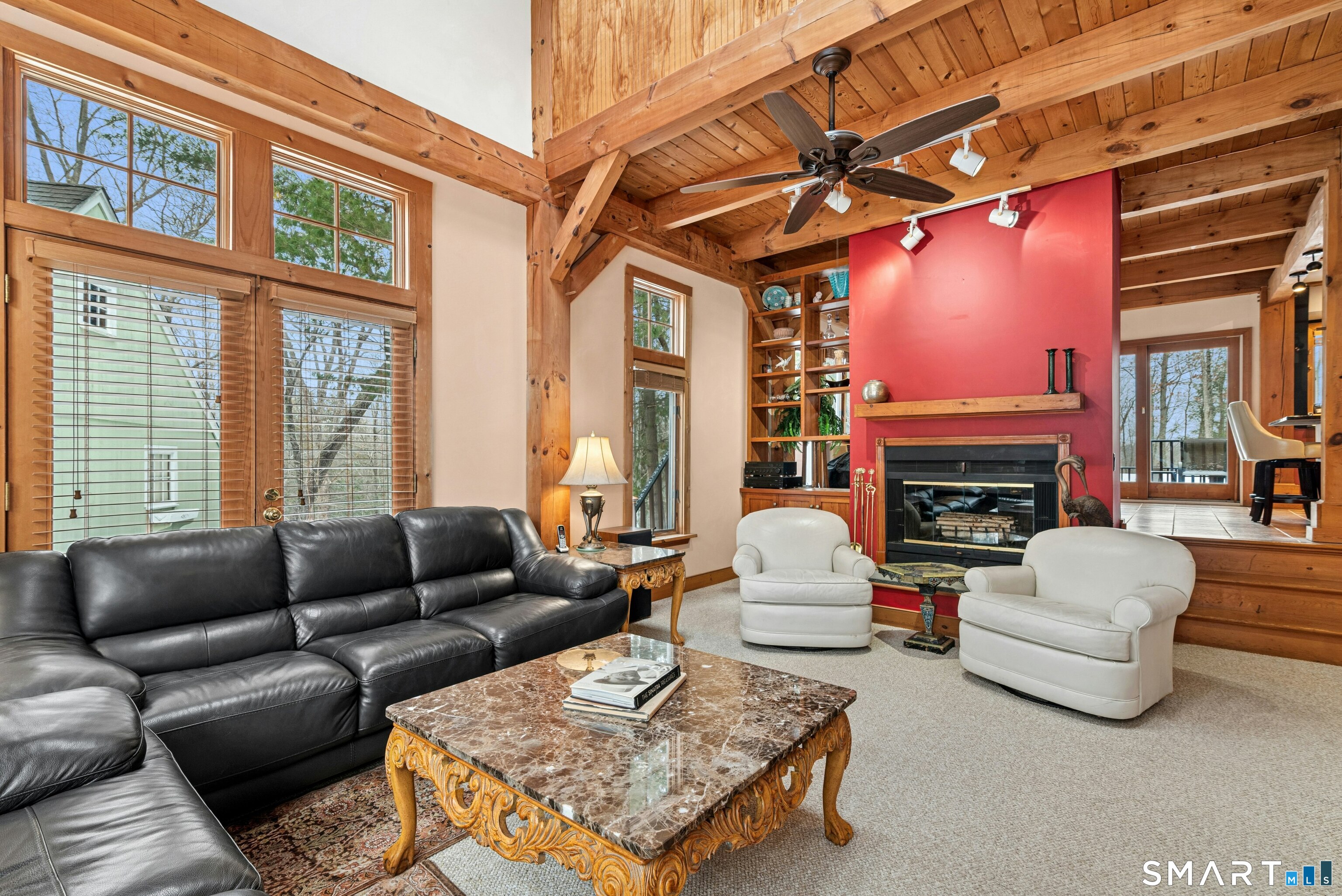 9 A Obtuse Rocks Road Brookfield, CT 06804 - Photo 6 of 36 a living room with furniture a fireplace and a large window