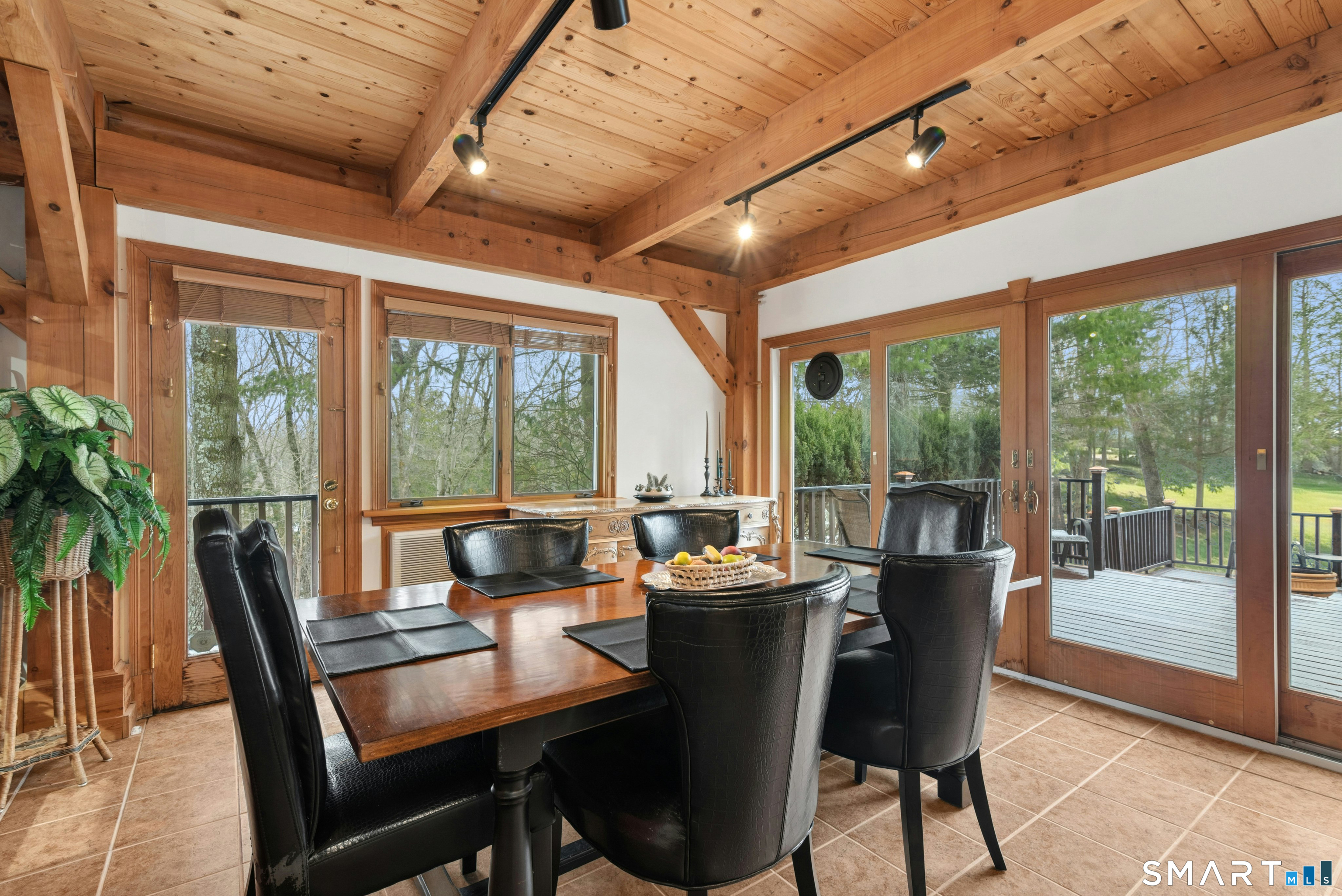 9 A Obtuse Rocks Road Brookfield, CT 06804 - Photo 7 of 36 a dining room with furniture wooden floor and a potted plant