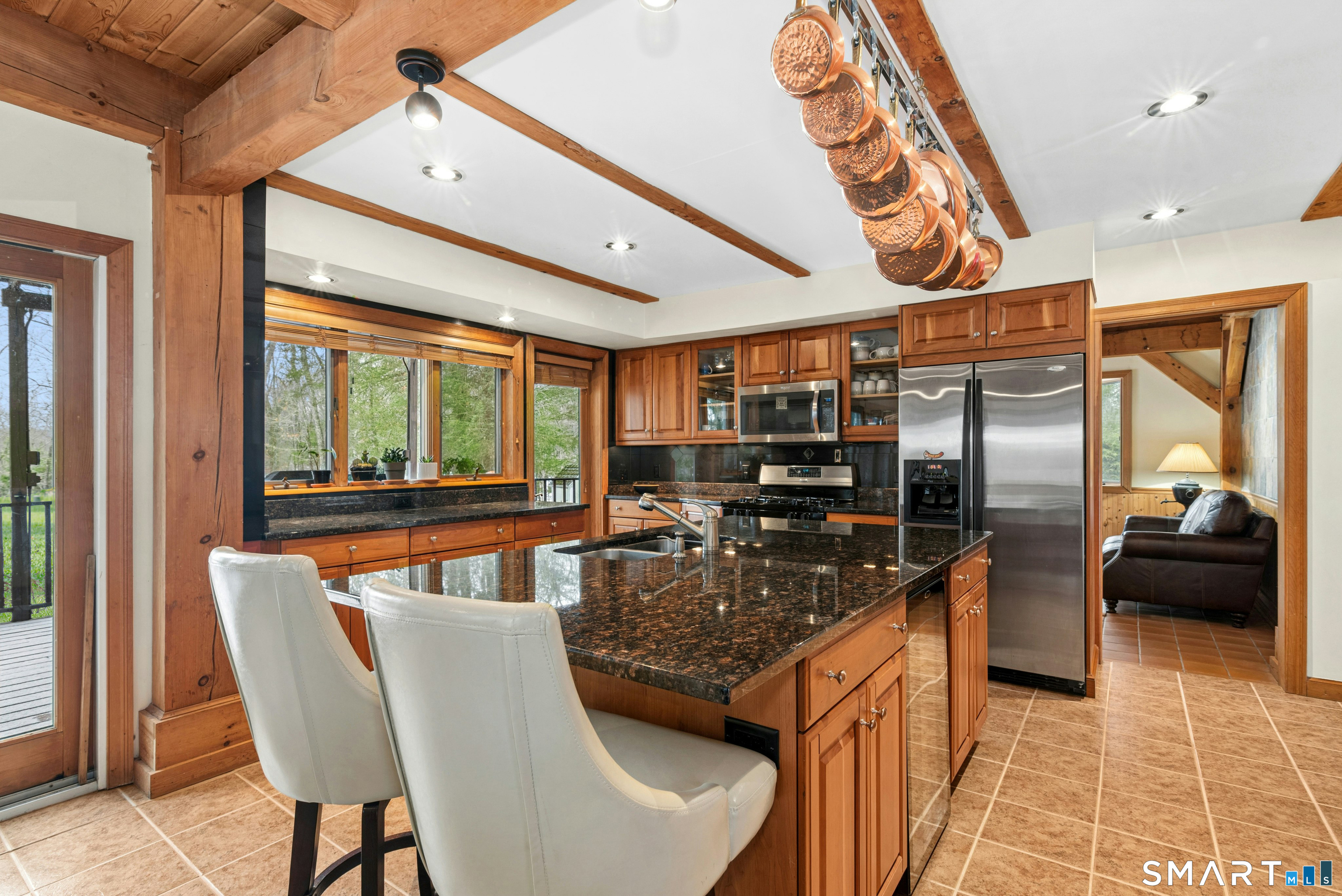9 A Obtuse Rocks Road Brookfield, CT 06804 - Photo 9 of 36 a kitchen with stainless steel appliances granite countertop a sink and a refrigerator