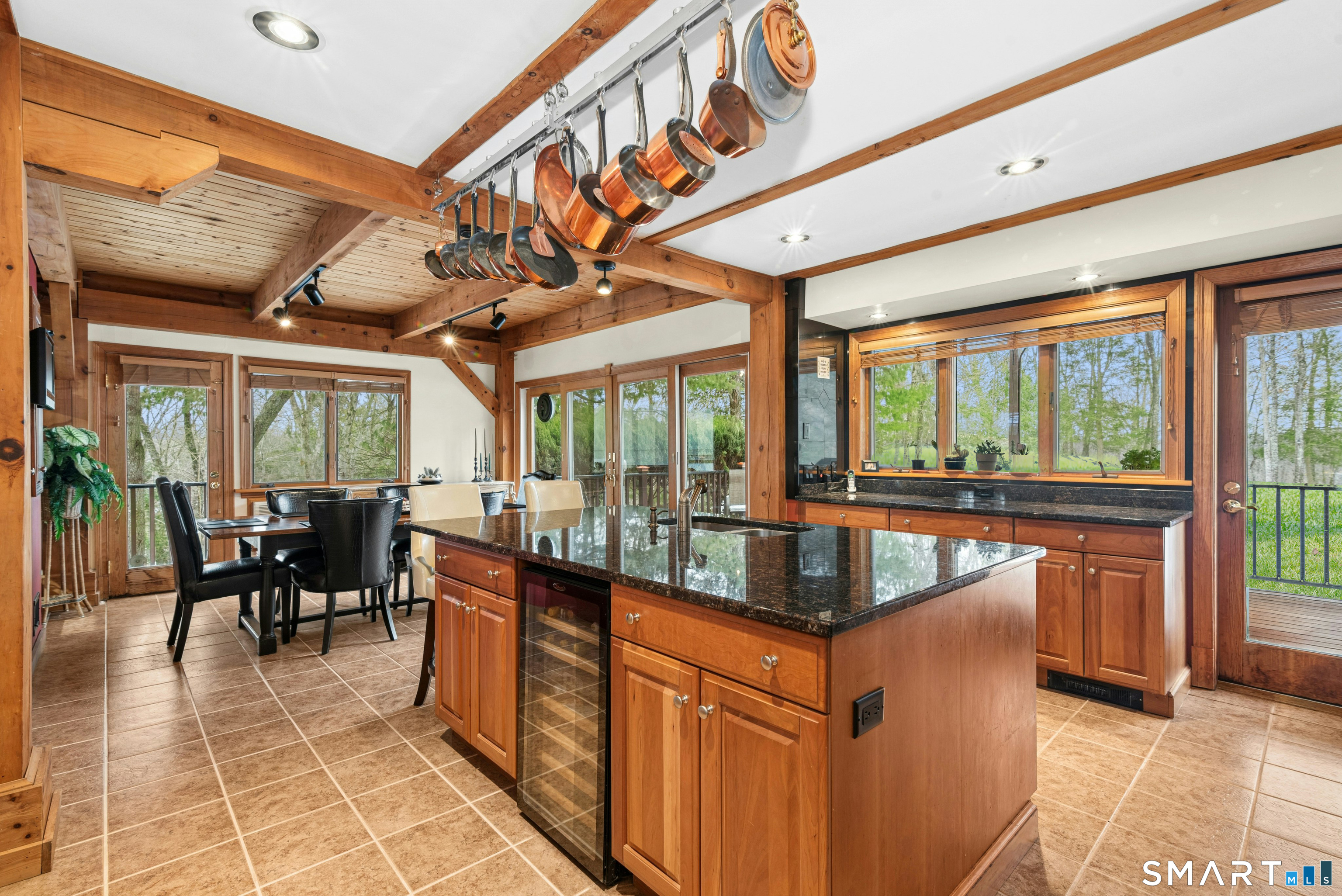 9 A Obtuse Rocks Road Brookfield, CT 06804 - Photo 10 of 36 a dining hall with stainless steel appliances granite countertop a barbecue grill and large windows
