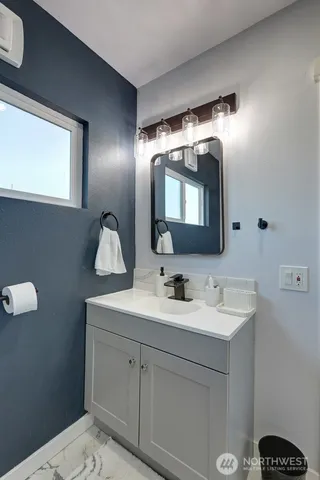 a bathroom with a sink and a mirror