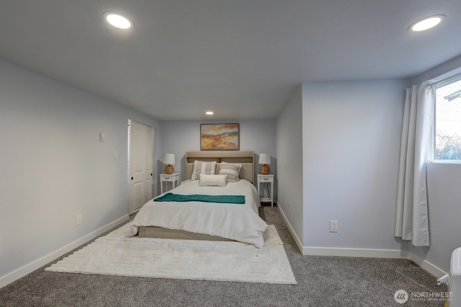 3217 South Durango Street Tacoma, WA 98409 - Photo 13 of 21 a bedroom with a bed and a large window