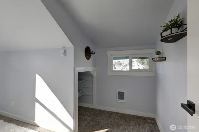 a view of a hallway with closet