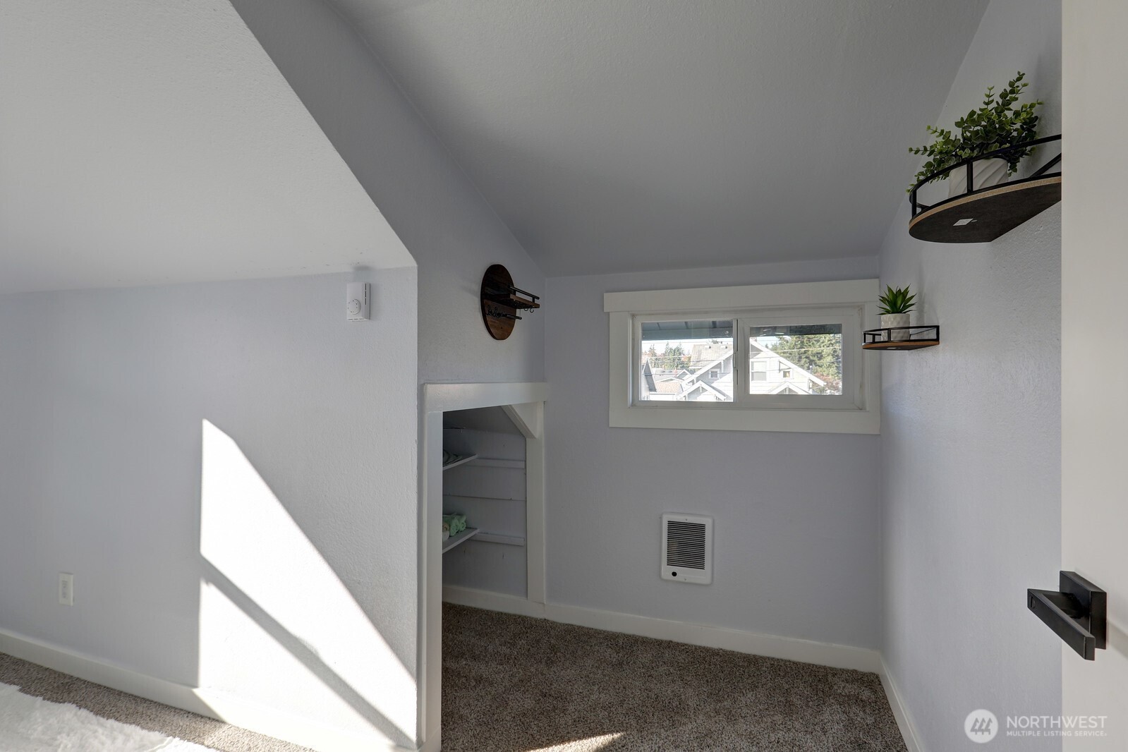 3217 South Durango Street Tacoma, WA 98409 - Photo 15 of 21 a view of a hallway with closet