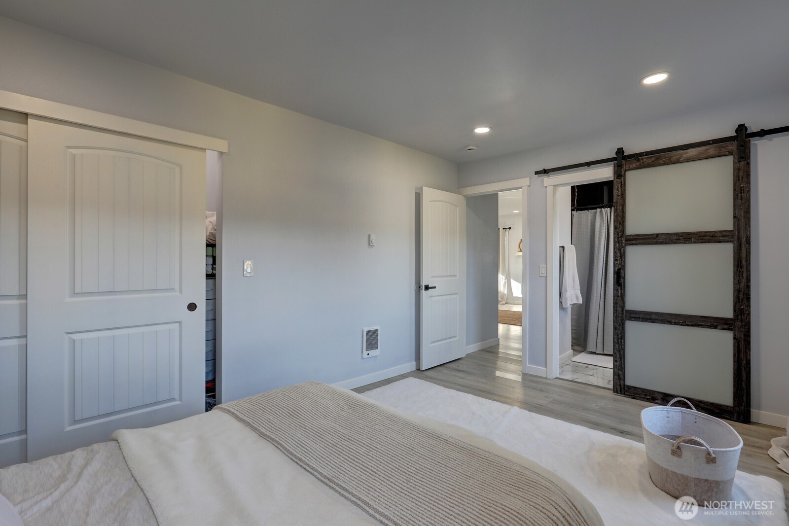 3217 South Durango Street Tacoma, WA 98409 - Photo 9 of 21 a spacious bedroom with a bed and a shower