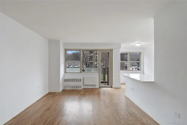 a view of an empty room with a window