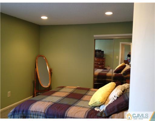 3 Westgate Drive Edison, NJ 08820 - Photo 14 of 14 a bedroom with a bed and walk in closet