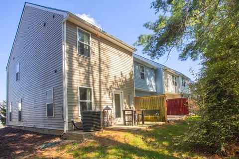 a view of a house with a backyard